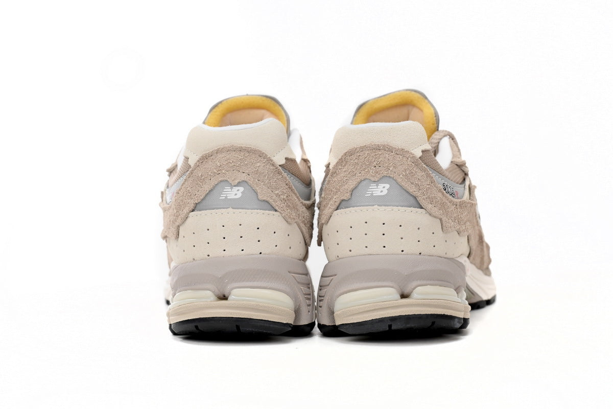 New Balance 2002R Women's & Men's Beige & Cream Distressed Retro Sneakers
