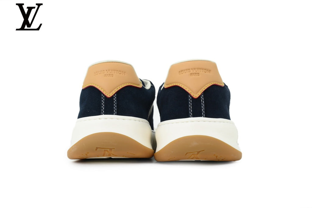 Louis Vuitton Low Top Sneaker in Navy Suede with White Leather Trim and Gum Sole